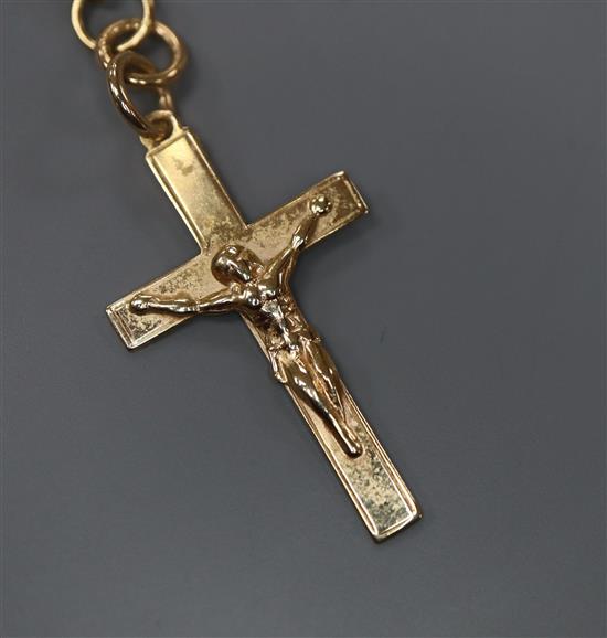 A 9ct gold crucifix pendant, on a 9k chain, 6 grams.